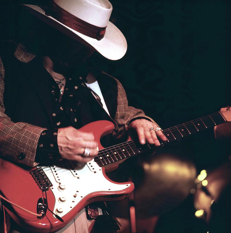 Musician with Red Electric Guitar Photograph - Photo Of Stevie Ray Vaughan by David Redfern