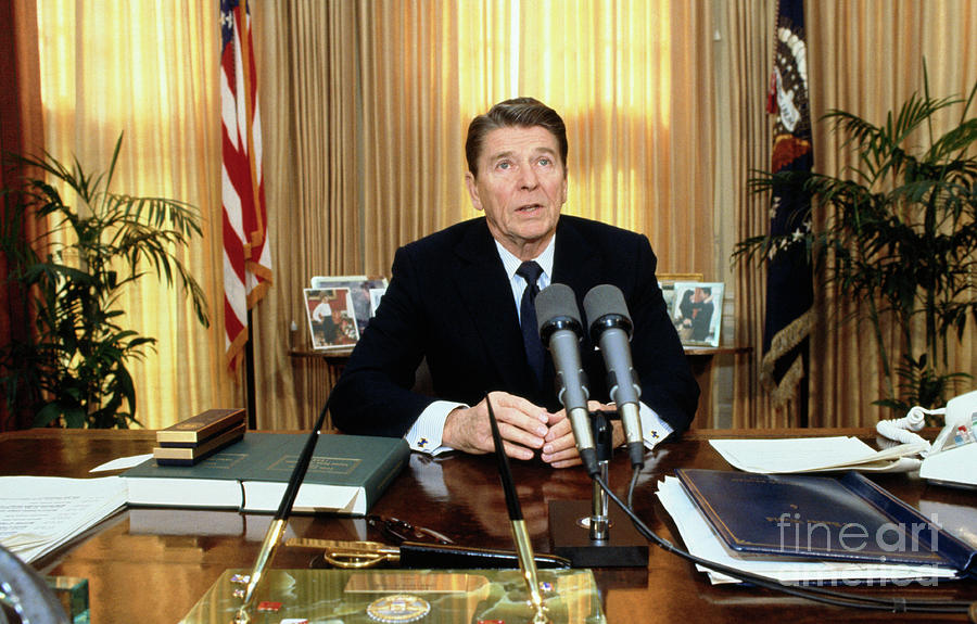 Ronald Reagan In The Oval Office by Bettmann