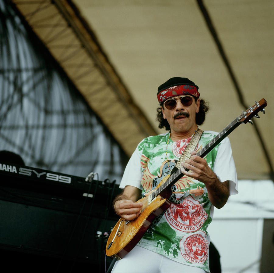 Famous Guitarist Performing on Stage Photograph - Santana Performs At New Orleans by David Redfern