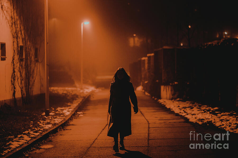 Silhouette Of Young Woman Walking Through City At Night by Wladimir ...