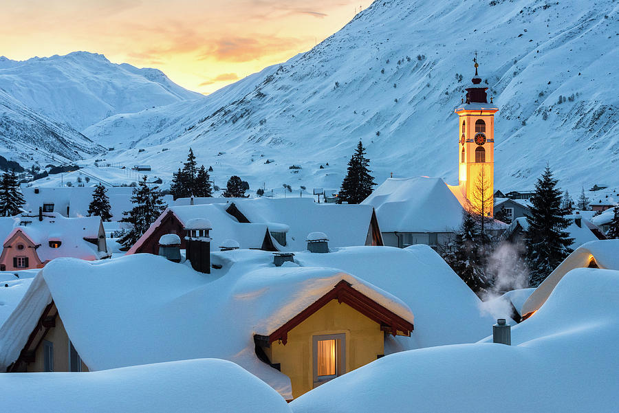 Switzerland, Uri, Andermatt, Alps, The Alpine Village Of Andermatt In The Winter Evening Digital Art by Alessandro Bellani
