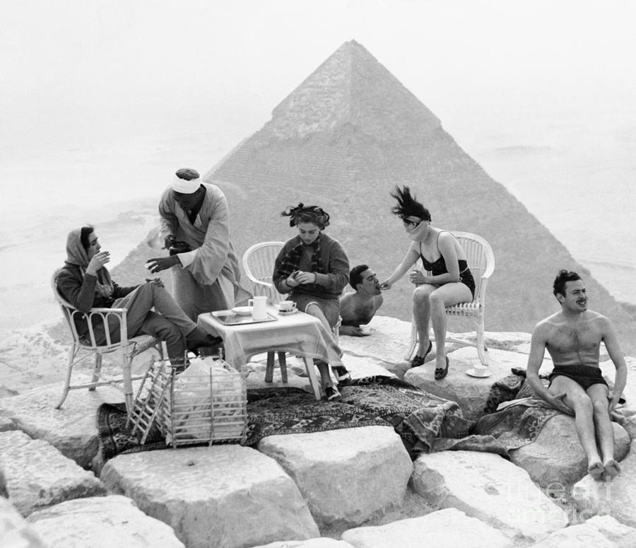 Tourists On Top Of Great Pyramid by Bettmann