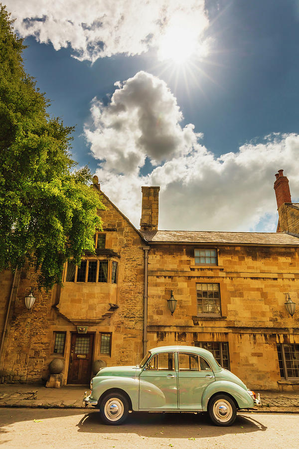 United Kingdom, England, Gloucestershire, Great Britain, Cotswolds, British Isles, Chipping Campden, An Old Car In Front Of A Traditional House In Chipping Campden On A Sunny Summer Afternoon Digital Art by Maurizio Rellini