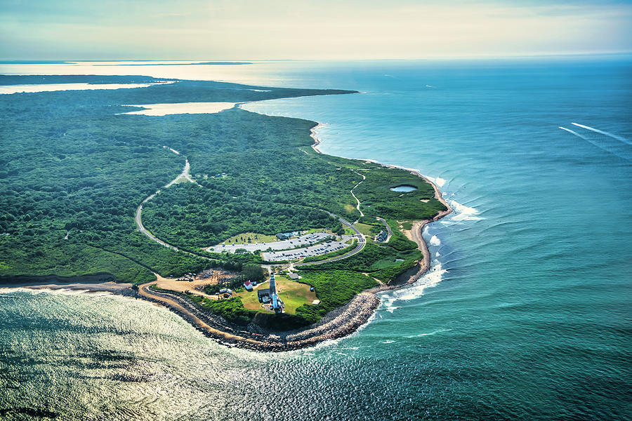 Usa, New York, Long Island, Aerial View Of Montauk Point Lighthouse Surrounded By Green Field And Ocean. Digital Art by Alejandra Uribe Posada