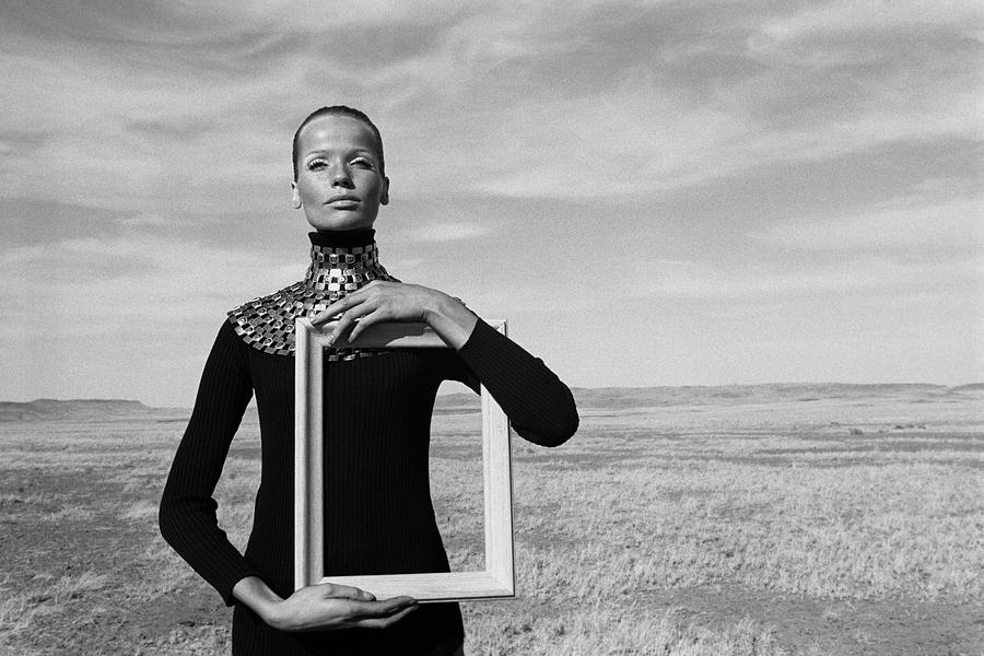 Veruschka Holding Empty Picture Frame In Field Photograph by Franco Rubartelli