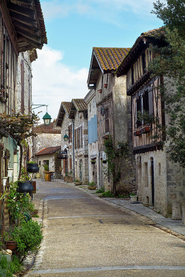 Rustic Village Street Scene Photograph - Empty streets in tranquil Pujols, Lot-et-Garonne, France. #1 by Seeables Visual Arts
