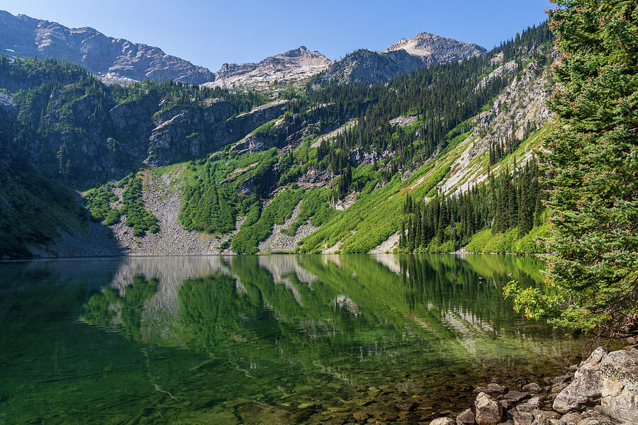 Serene Mountain Lake Reflection Photograph - Mirror image reflection of Rainy Lake in North Cascades National #1 by Steven Heap