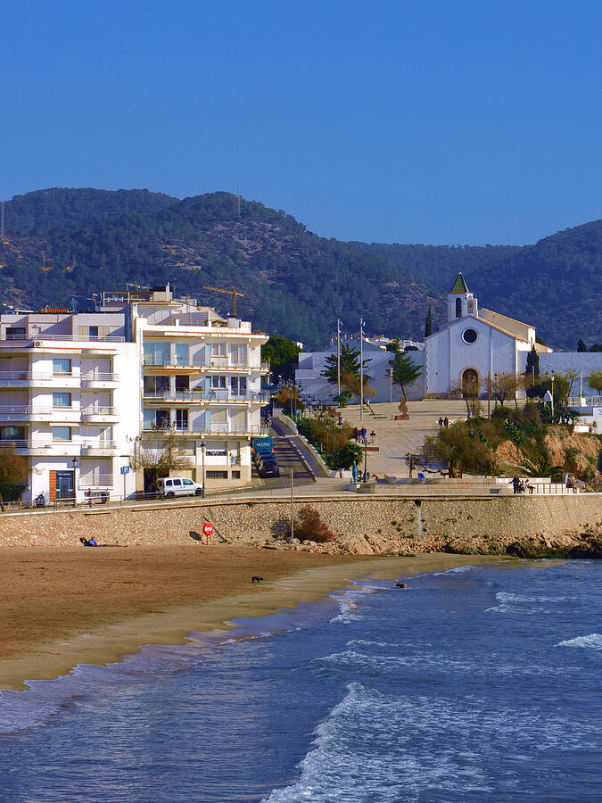 Coastal Town with Scenic Chapel Photograph - Sitges Spain Art Print Sant Sebastia Beach Promenade Palm Trees and Modern Architecture #1 by Travel Essayist