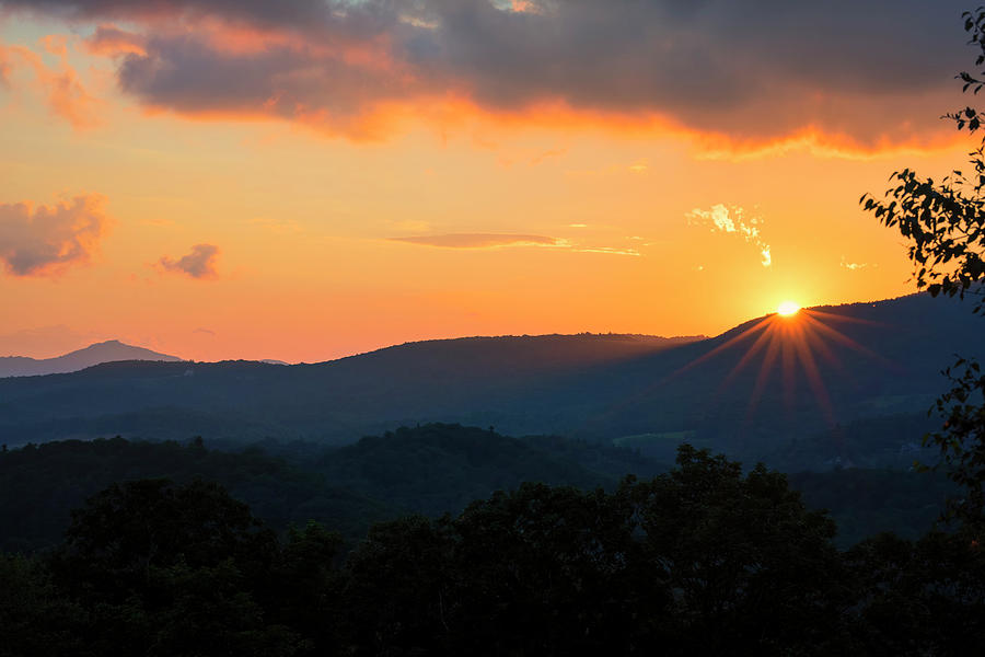 Sun Dips Below the Horizon #1 Photograph by Charles Floyd