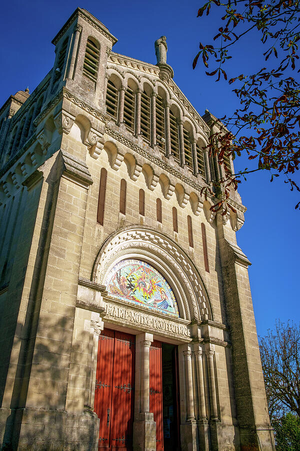 Historic Church Exterior Under Blue Sky Photograph - The hilltop church of Notre-Dame de Peyragude in Penne dAgenais #1 by Seeables Visual Arts