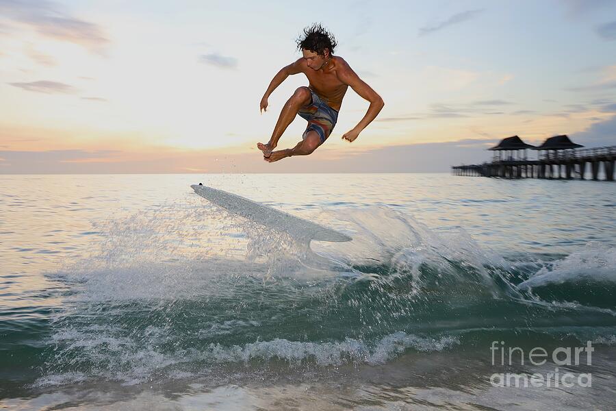 Surfer Performs Stunt at Sunset Photograph - 9254 #2 by Donn Ingemie