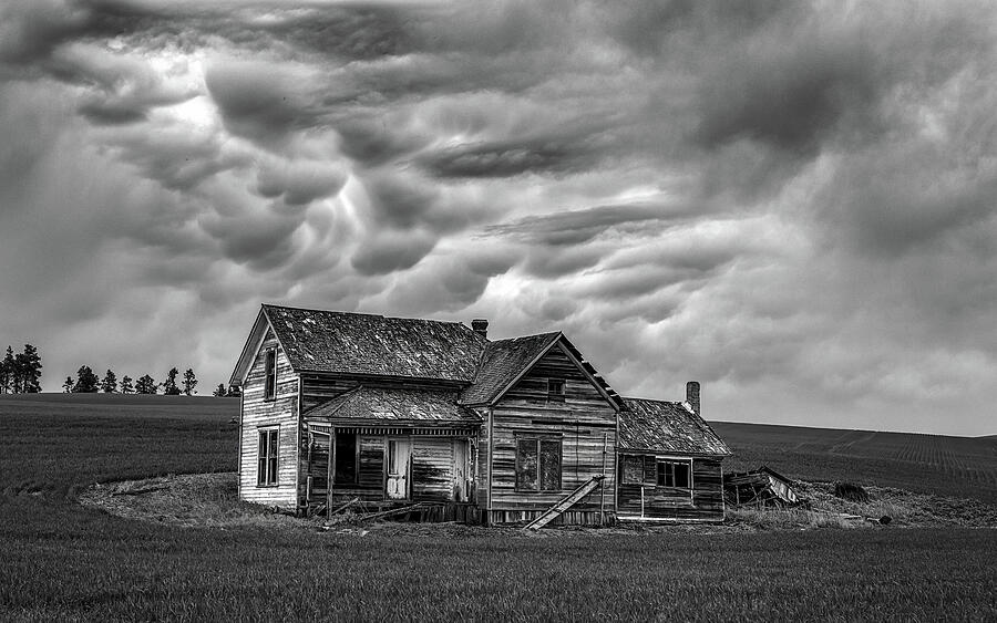 Abandoned Farmhouse Under Stormy Skies Photograph - A Storm Is Brewing by Kevin Schwalbe