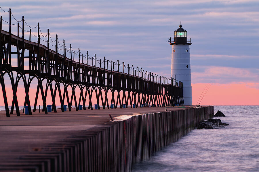 Afterglow at the Manistee North Pier Light Photograph by Michael Collins