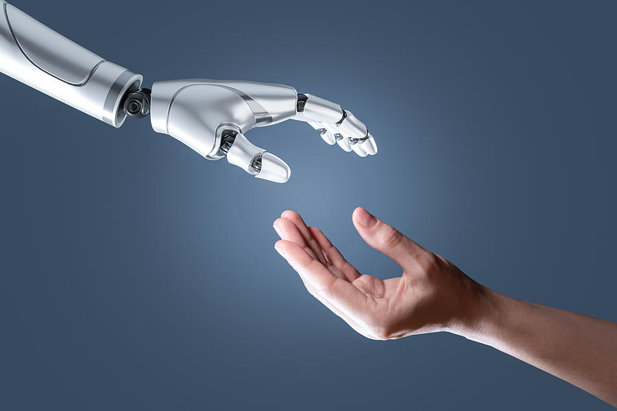 Artificial intelligence robot hand and human hand Photograph by Vithun Khamsong
