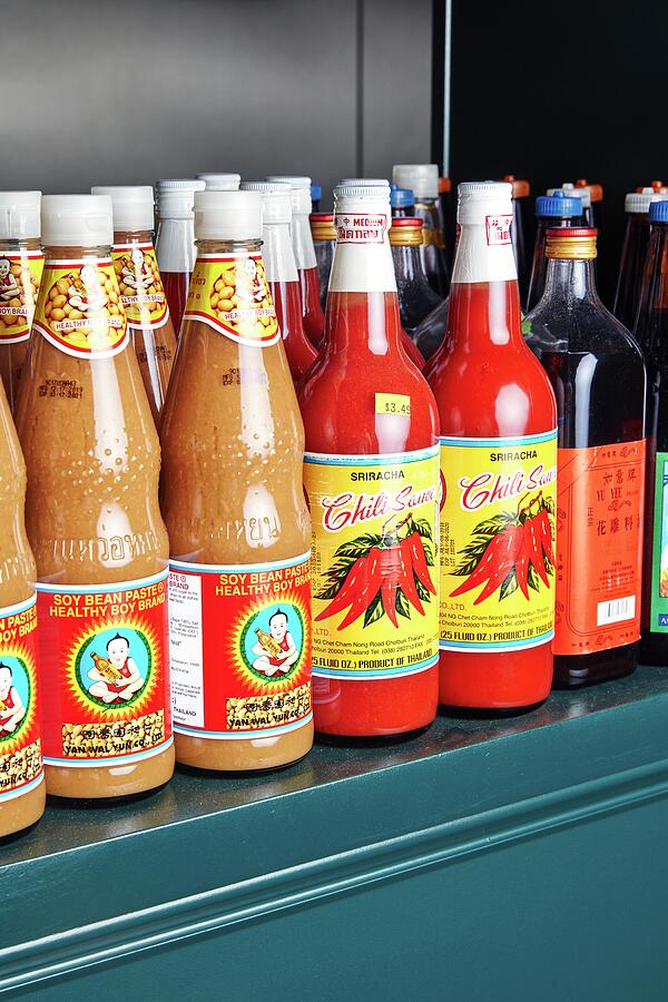 Imported Condiments Asian Condiments on a Shelf by Emma Fishman