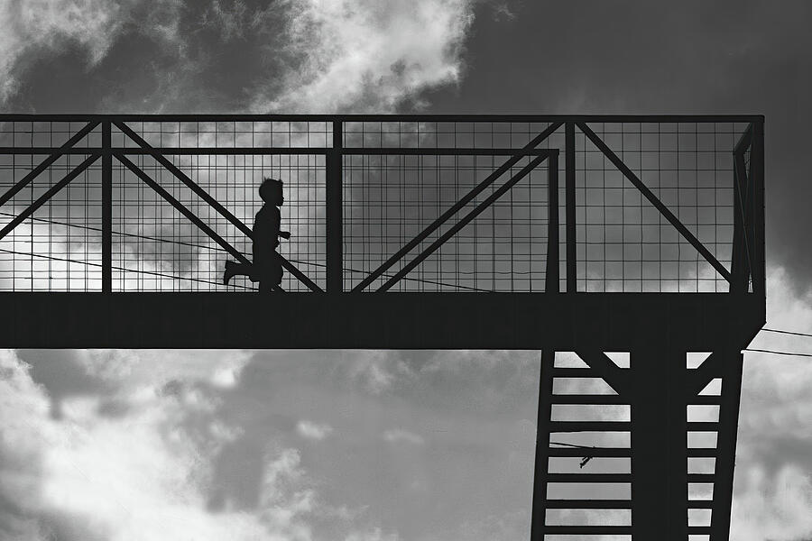 Silhouette of Runner on Bridge Photograph - Boy running on highway bridge in Guatemala BW by Tatiana Travelways