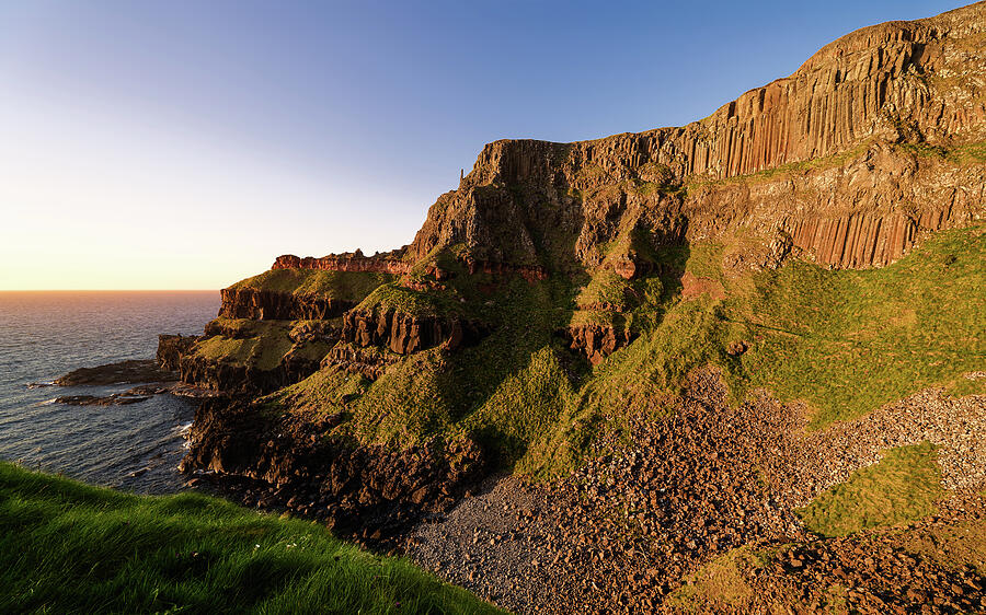 Sunlit Coastal Cliffs at Sunset Photograph - Cliffs at the Giants Causeway by Steven Nelson