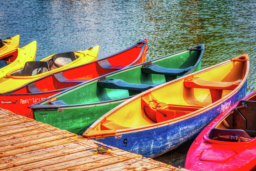 Colorful canoes by the dock Photograph by Tatiana Travelways