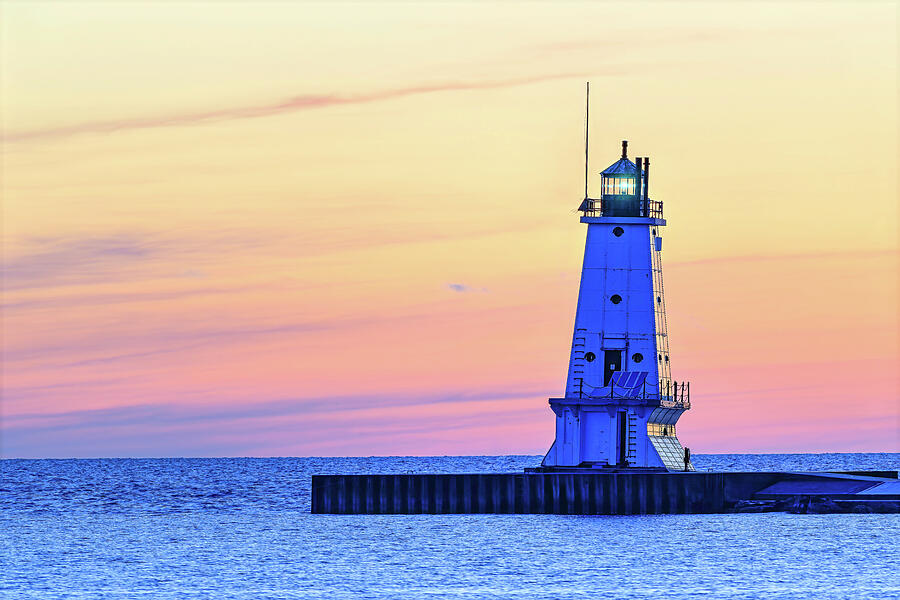 Dusk at the Ludington North Pier Light Photograph by Michael Collins