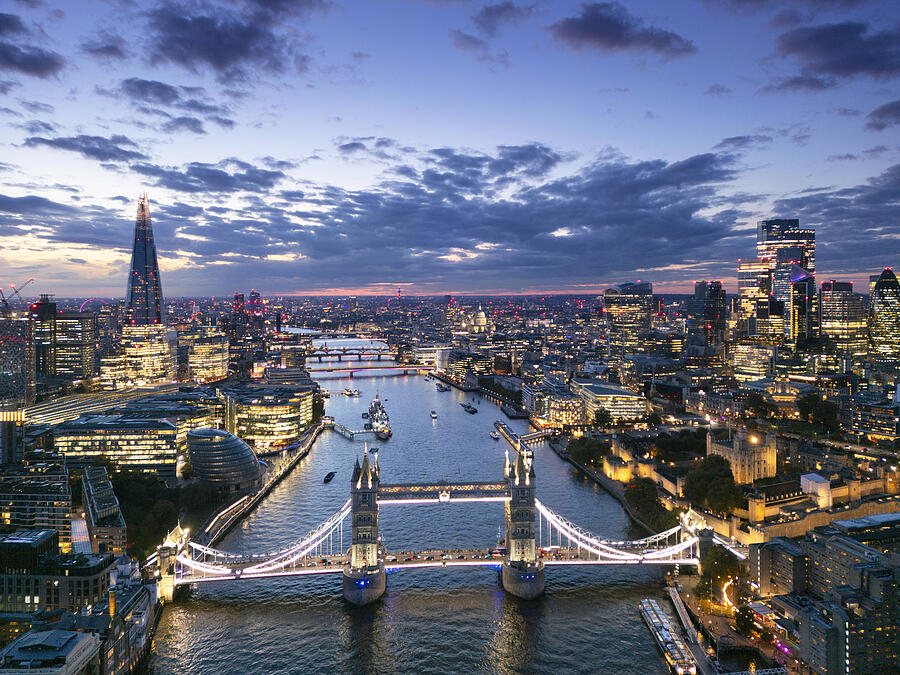 Elevated view along River Thames in London at dusk Photograph by Gary Yeowell