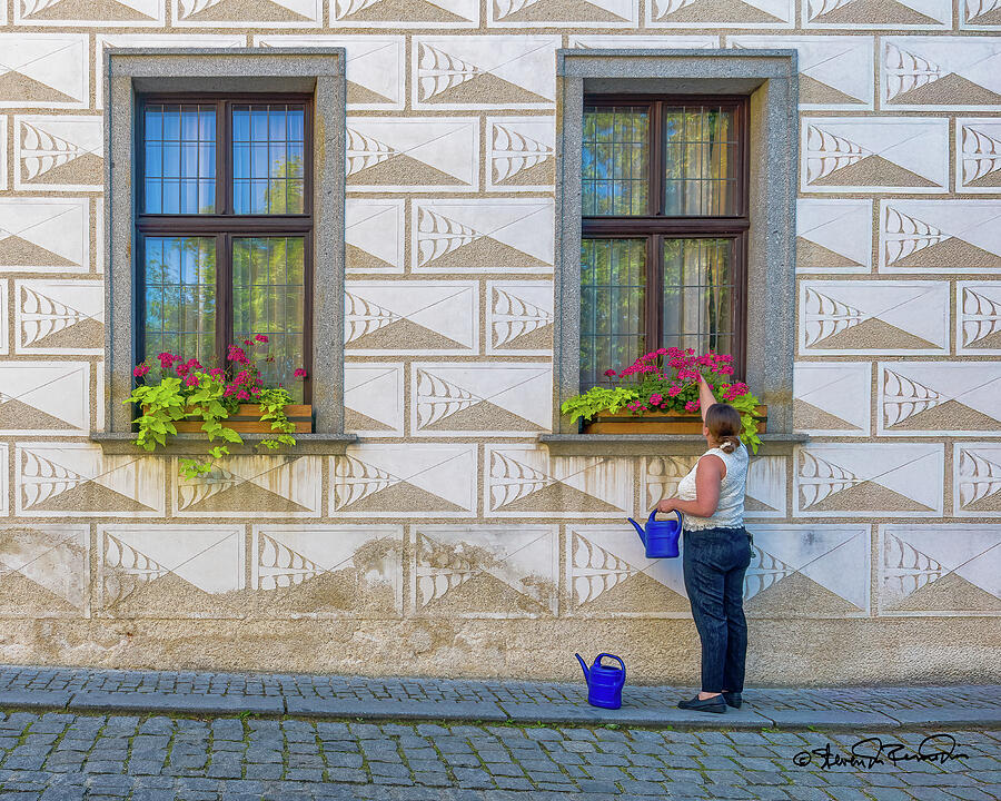 Woman Watering Window Flowers Photograph - Gardening in Cesky Krumlovs charming streets by Steven Dos Remedios