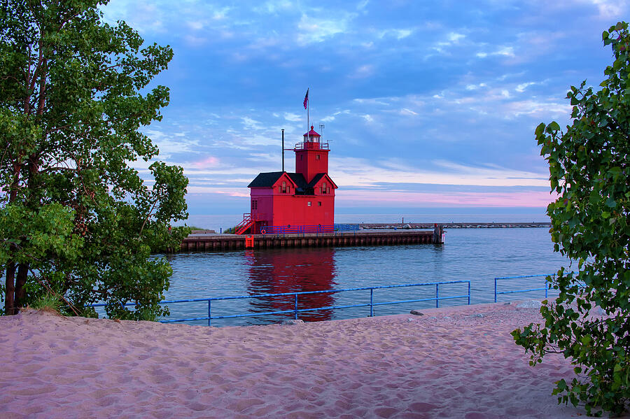 Red Lighthouse by the Water Photograph - Holland Harbor Lighthouse by Michael Collins
