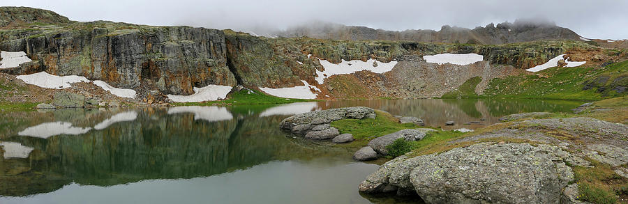 Jagged cliff reflections Photograph by Sunniye Buesing