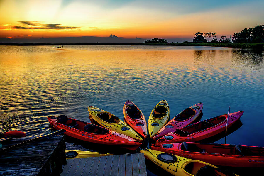 Kayaks Resting in the Sunset Photograph by Anthony Hightower