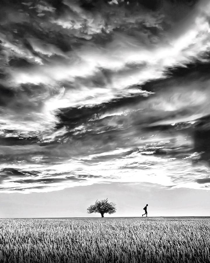 Man Running Under a Stormy Sky Photograph - Storm approaching by Sofie Conte