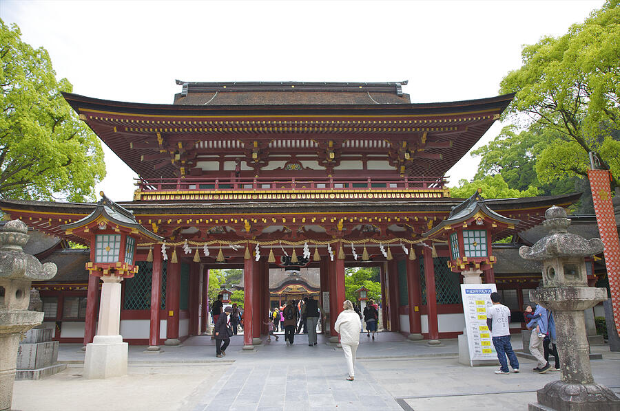 People walking through shrine entrance Photograph by Barry Winiker