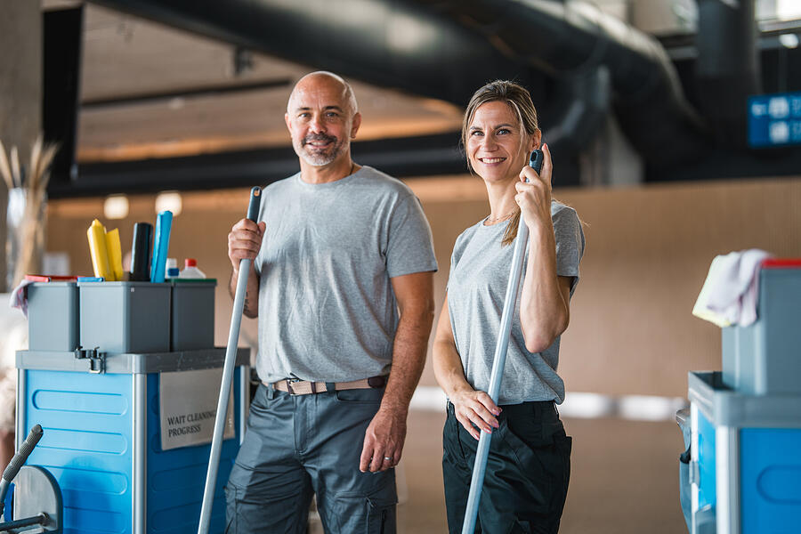 Professional Cleaning Team In Airport Environment With Equipment Azmanl