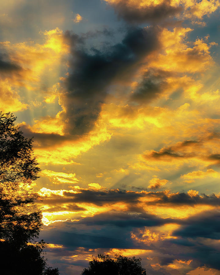 Rising Sun Bathes the Clouds in Golden Light Photograph by Charles Floyd