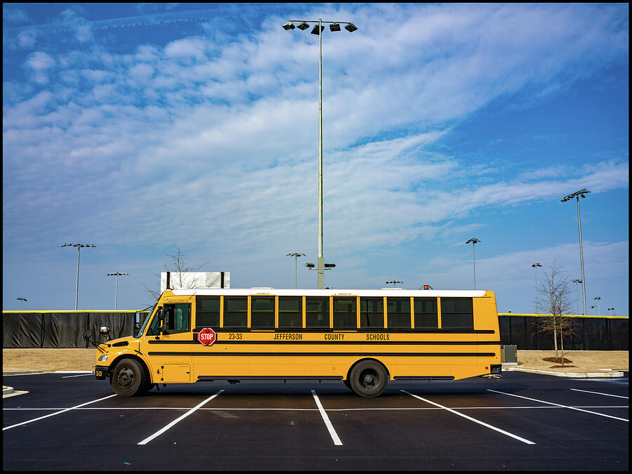 School Bus in Empty Parking Lot Photograph - Schoolbus at a Baseball Tournament by Jeremy Butler