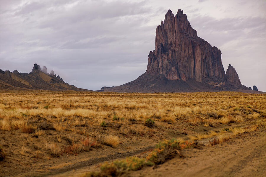 Majestic Rock Formation in Desert Photograph - Shiprock After Rain  New Mexico Desert Light by Robert Niemeier