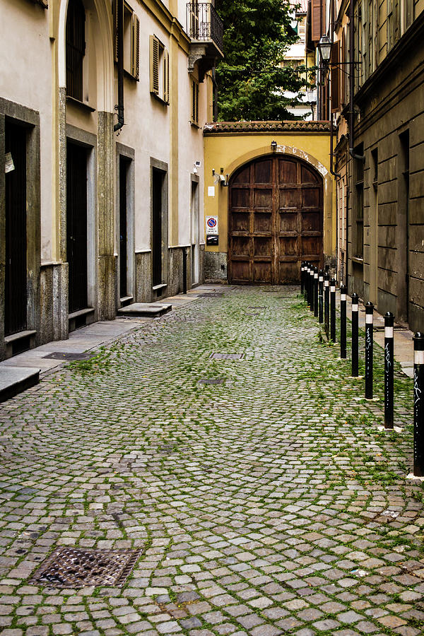 Side street with arched garage door Photograph by Craig A Walker