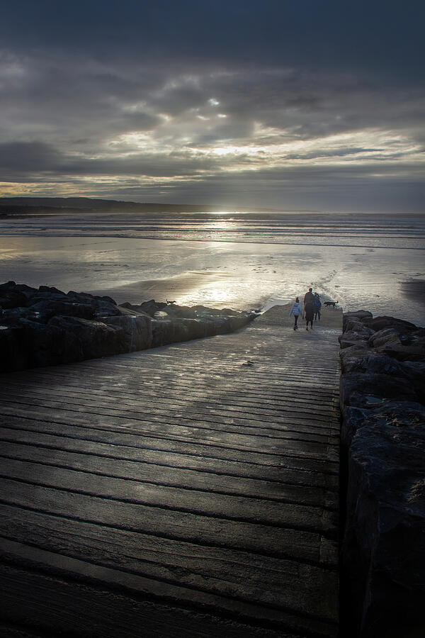Evening Walk by the Shore Photograph - Silver Light Stroll at Lahinch Beach by Mark Callanan
