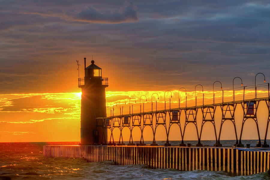 South Haven South Pier Light at Sunset Photograph by Michael Collins