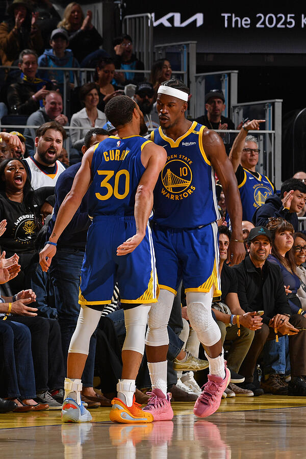 Stephen Curry and Jimmy Butler celebrate for the Golden State Warriors
