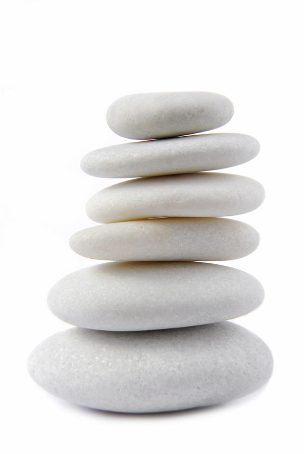 The white stone pebble zen isolated on white Photograph by Severija Kirilovaite