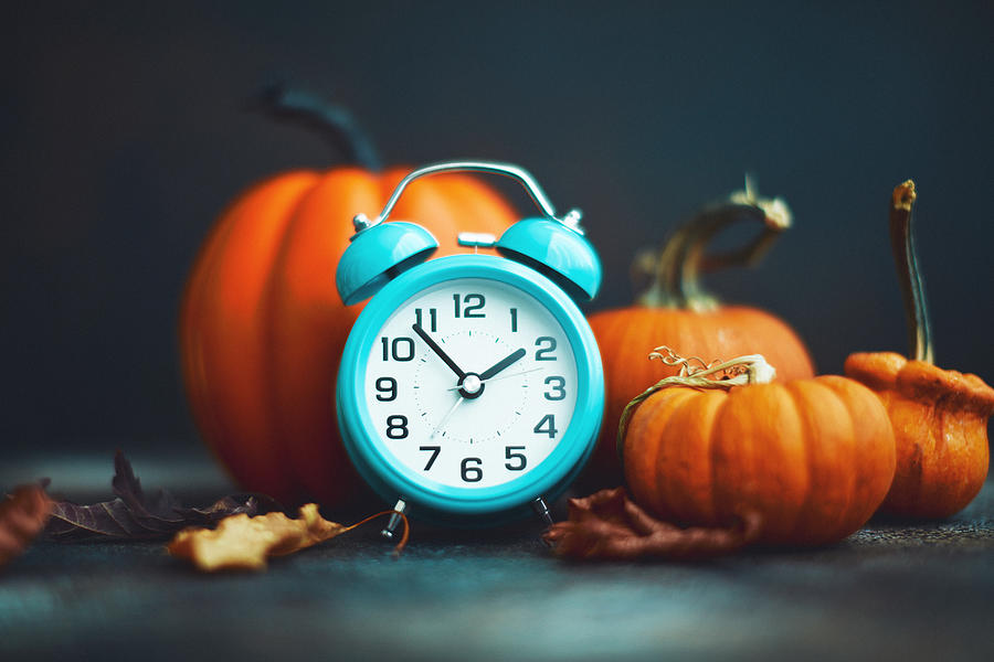Time for Fall. Teal alarm clock with leaves and Pumpkins Photograph by CatLane