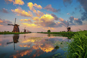 Sunset above old dutch windmills in Kinderdijk, Netherlands #5 Photograph by Miroslav Liska