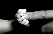 Father's finger touching his baby's foot Photograph by Sami Sarkis Photography