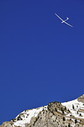 Glider flying over snowy mountain Photograph by Sami Sarkis Photography