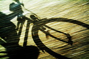 Shadow of a person riding a bicycle Photograph by Sami Sarkis Photography