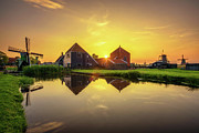 Sunset above farm houses and windmills of Zaanse Schans in the Netherlands Photograph by Miroslav Liska