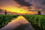 Sunset above old dutch windmills in Kinderdijk, Netherlands Photograph by Miroslav Liska
