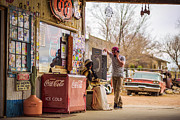 Young man uses a vintage telephone at a retro gas station Photograph by Miroslav Liska