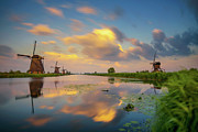 Sunset above old dutch windmills in Kinderdijk, Netherlands #8 Photograph by Miroslav Liska