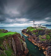 Dark clouds move over the Fanad Head Lighthouse in Ireland Photograph by Miroslav Liska
