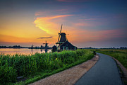 Sunset above historic windmills of Zaanse Schans in the Netherlands Photograph by Miroslav Liska